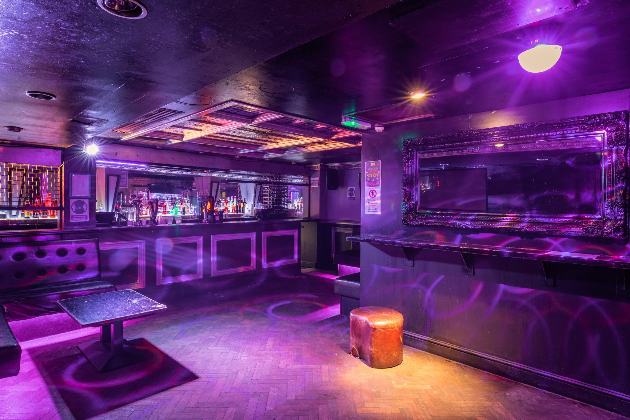 Stylish dimly lit bar at The Hatch Club, perfect for cocktail parties and nightlife events.