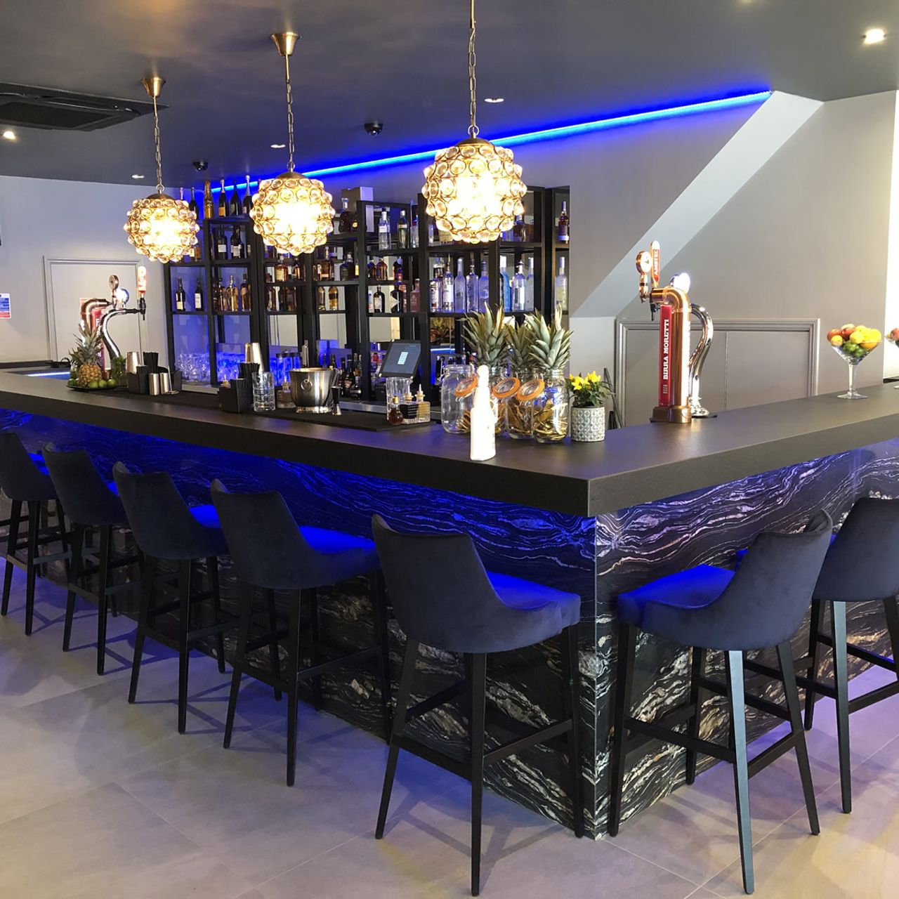 Sleek modern bar at The Hatch Club, perfect for networking events and social gatherings.
