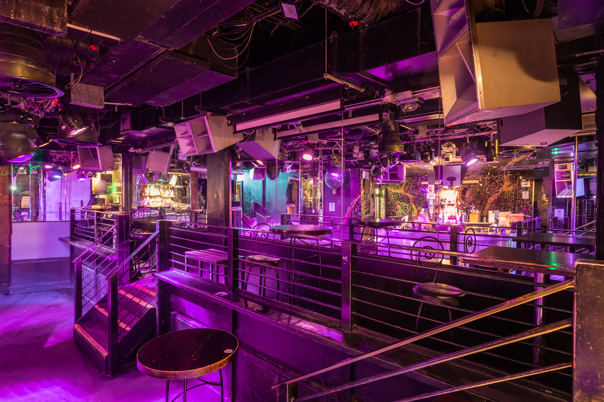 Vibrant event space at The Hatch Club with dynamic lighting for parties and performances.