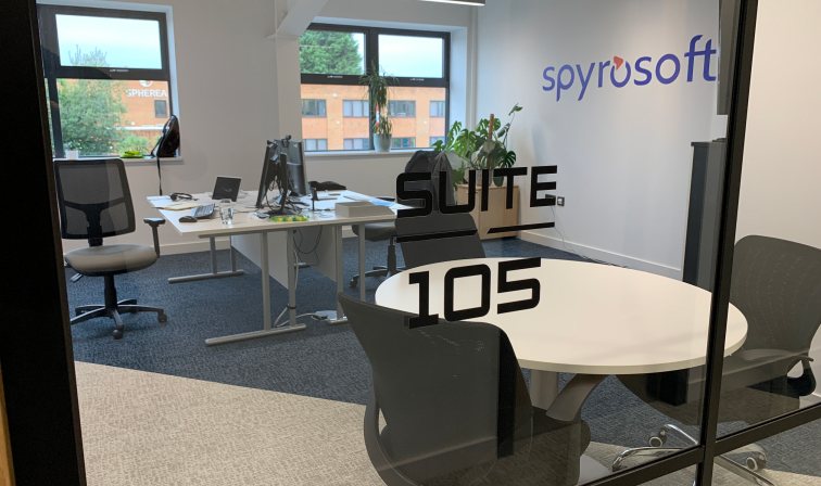 Modern serviced office with round table for meetings, ideal for collaboration and productivity.