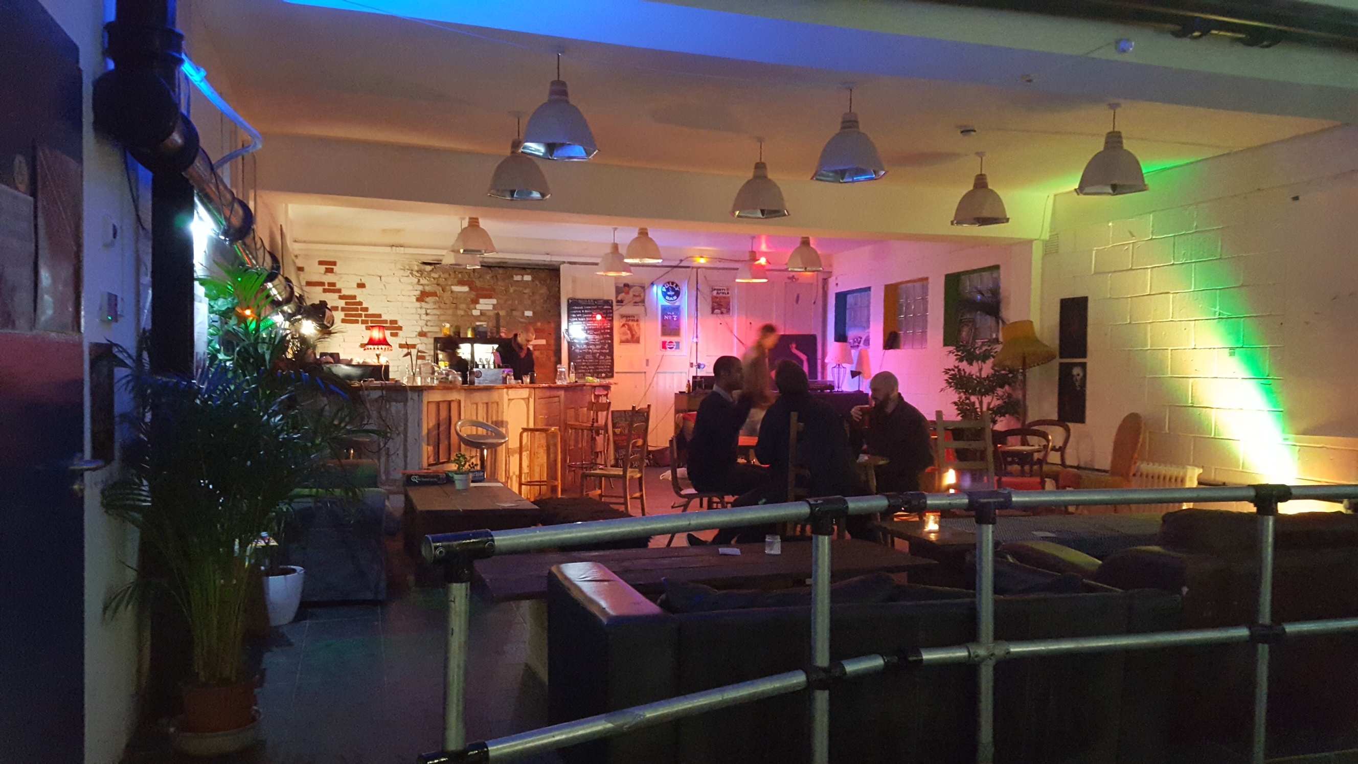 Recording studio event space with ambient lighting for networking and casual gatherings.