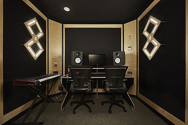 Modern recording studio with professional monitors for music events and workshops.