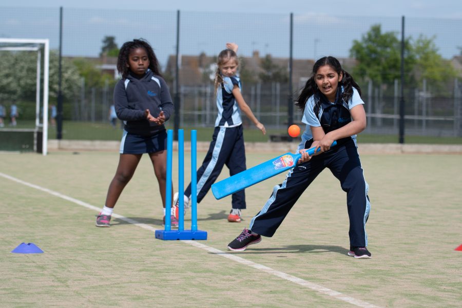 Netball courts at Northampton High School during a vibrant youth sports event.