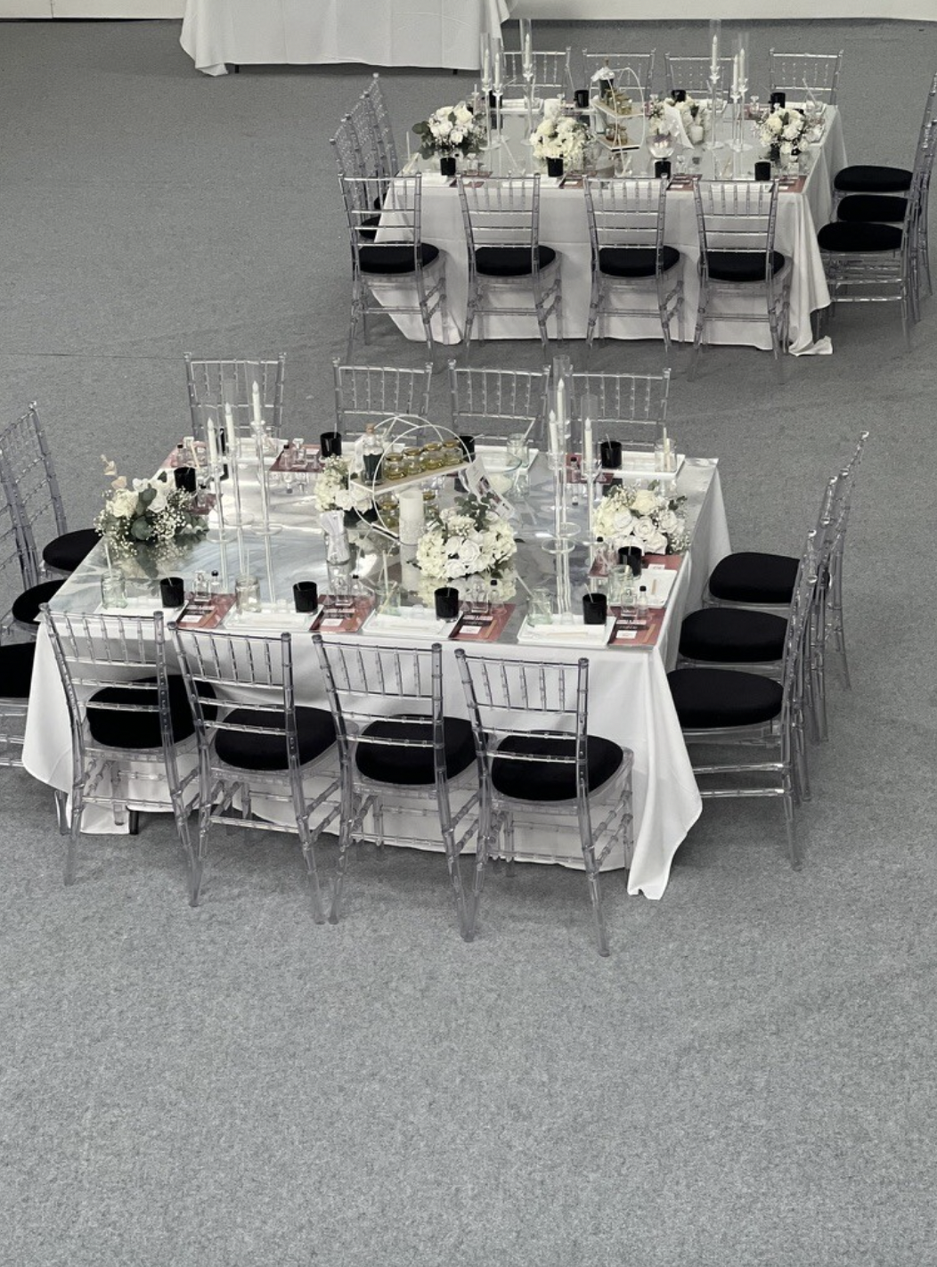 Elegant banquet table with floral centerpiece, ideal for weddings and corporate events.