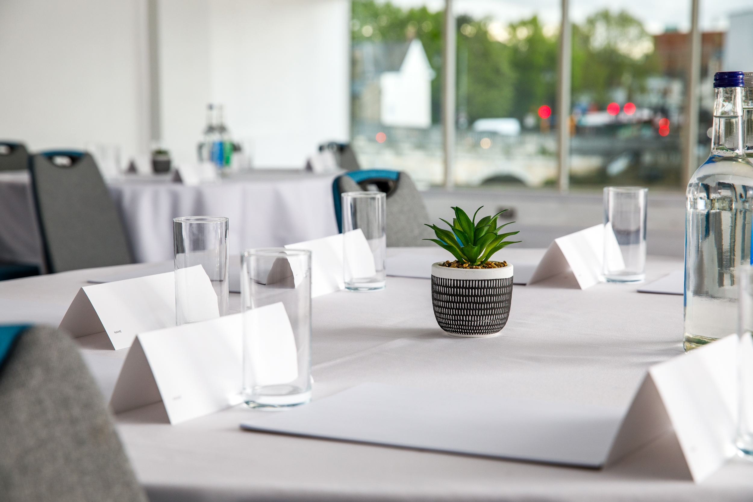 Pilgrim Suite meeting setup at Mercure Bedford, featuring tables and decor for events.