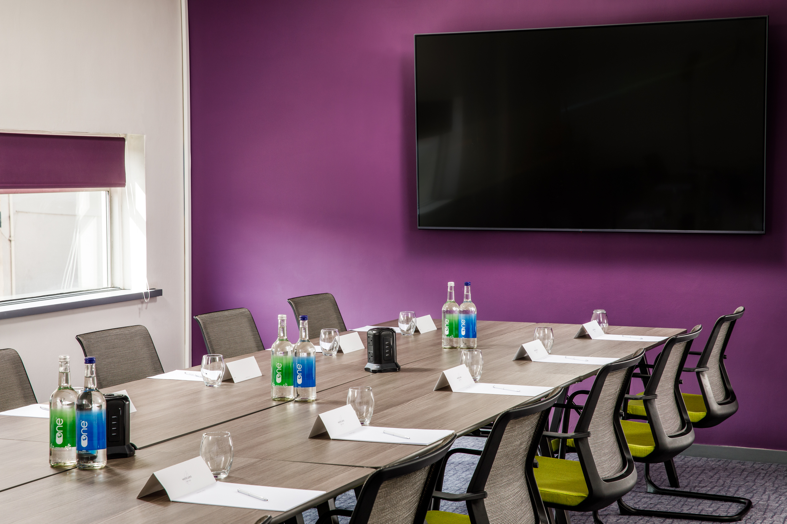 Modern meeting room at Mercure Bedford Hotel with large table, ideal for brainstorming sessions.