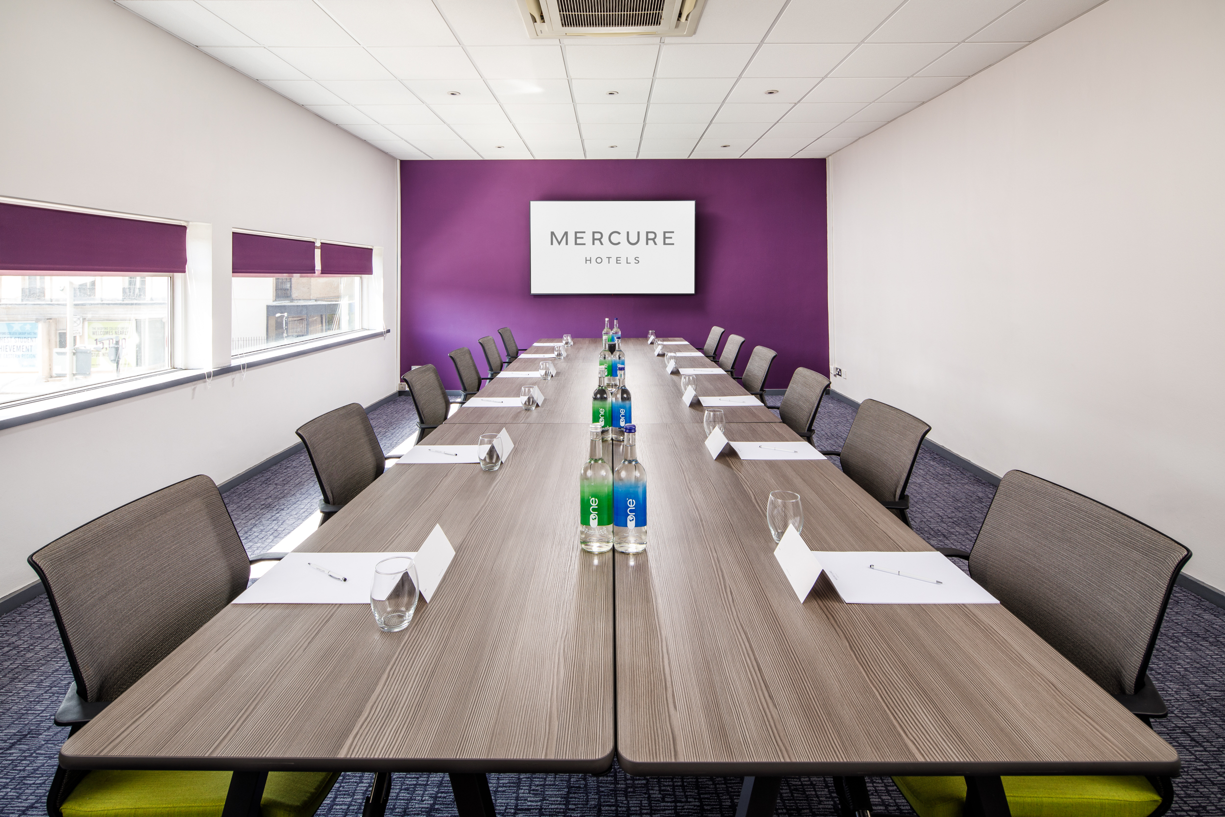 Meeting room at Mercure Bedford Hotel with modern decor for professional events.