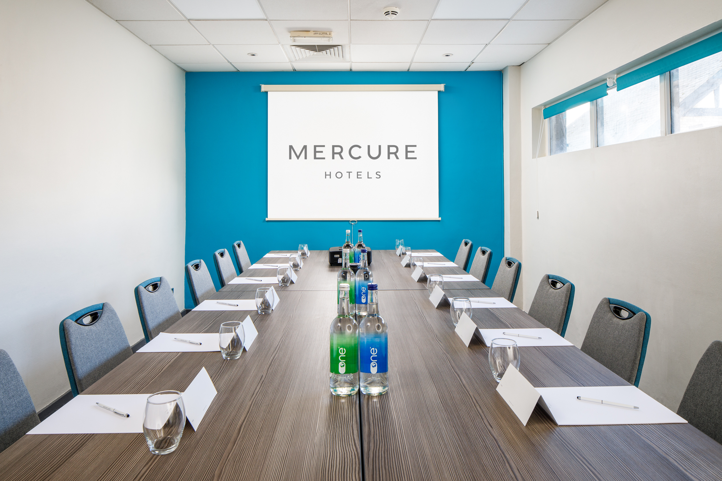 Meeting room at Mercure Bedford with long table, ideal for corporate events and workshops.