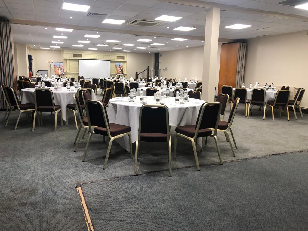 St David's Suite at Mercure Cardiff North Hotel, spacious event space with round tables.