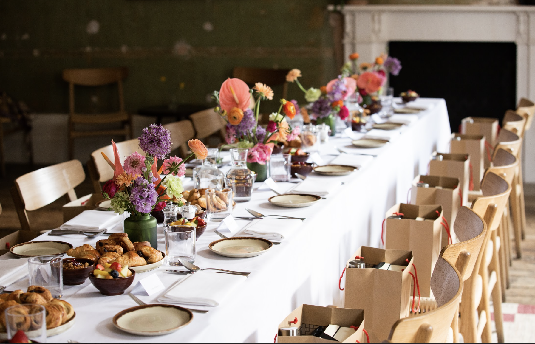 Elegant dining setup with floral centerpieces for a corporate event at Knotel Workclub.