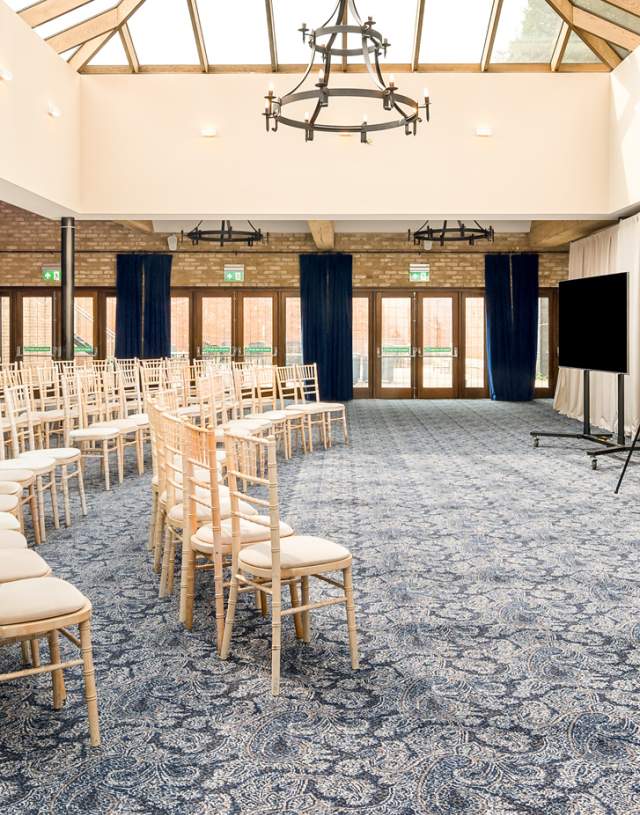 Meeting Room in Haslemere Hall with elegant chairs for professional presentations.