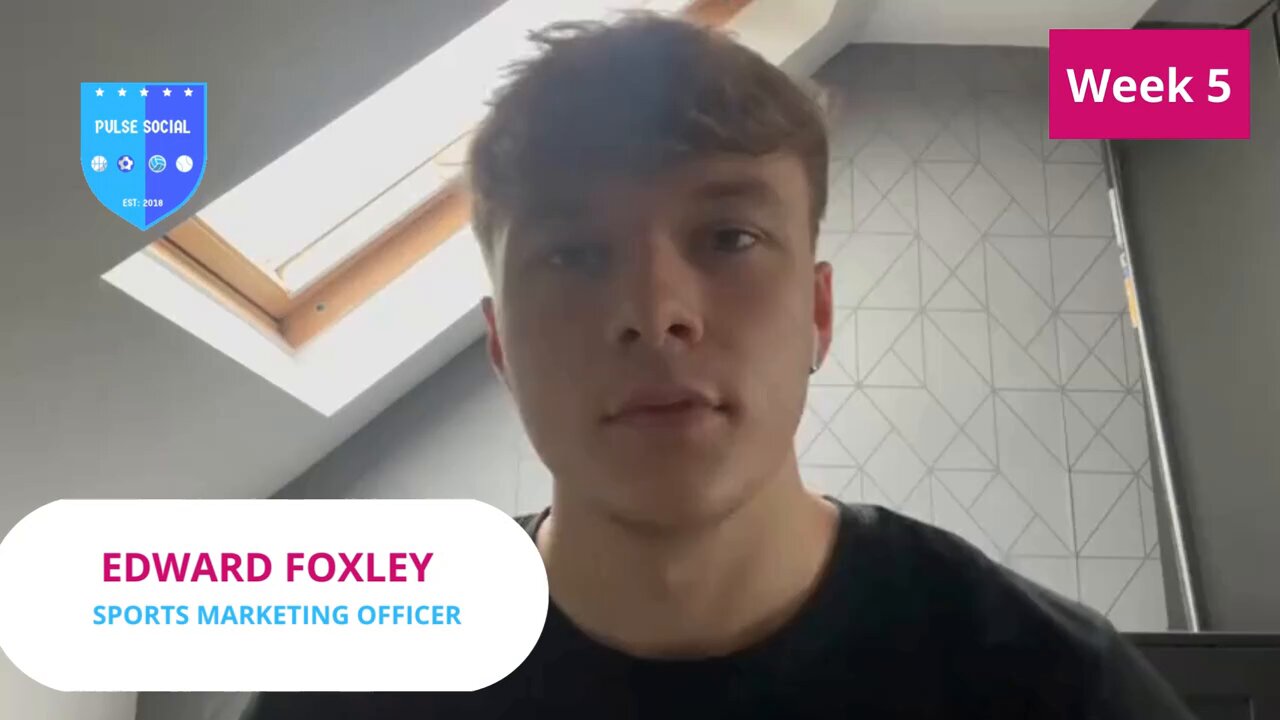 Young professional in virtual meeting setup at Space Sports Centre, online event presentation.