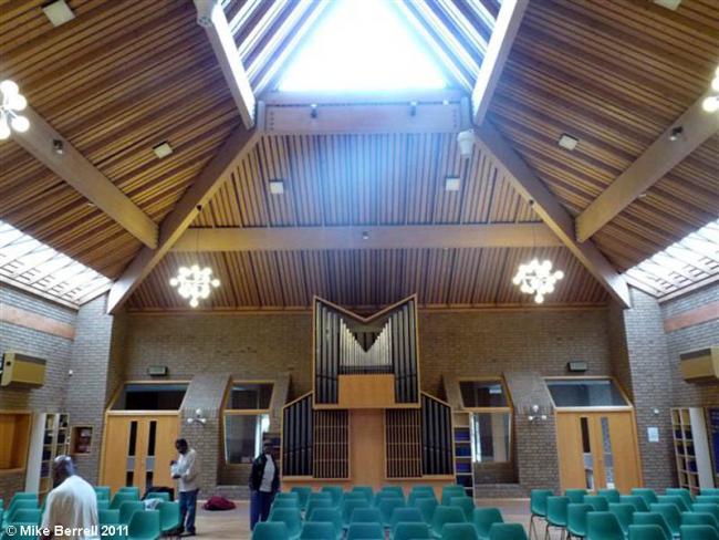 Spacious Whalley Range Methodist Church meeting room with wooden ceiling, ideal for conferences.