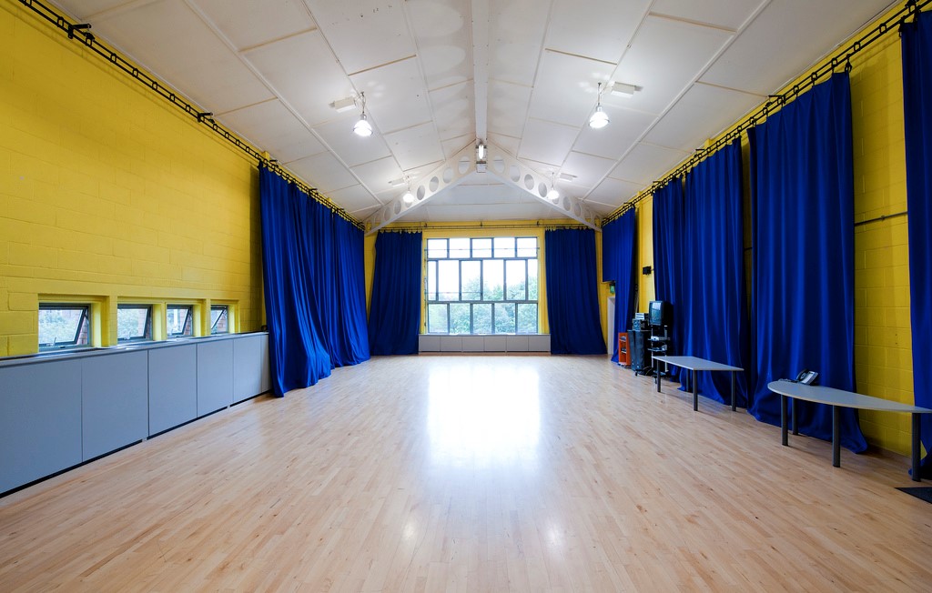 Spacious event room with yellow walls, ideal for workshops in Contact Theatre Manchester.