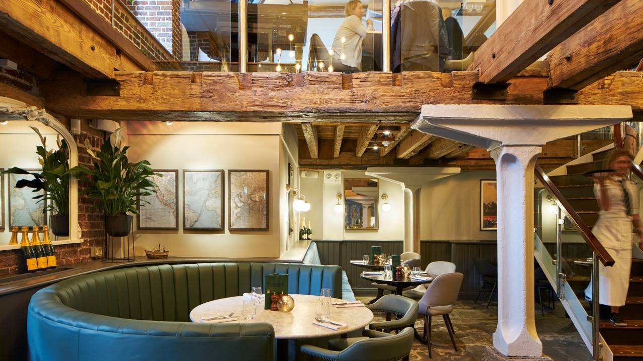 Stylish Cellar Bar with rustic beams, ideal for intimate meetings and events.