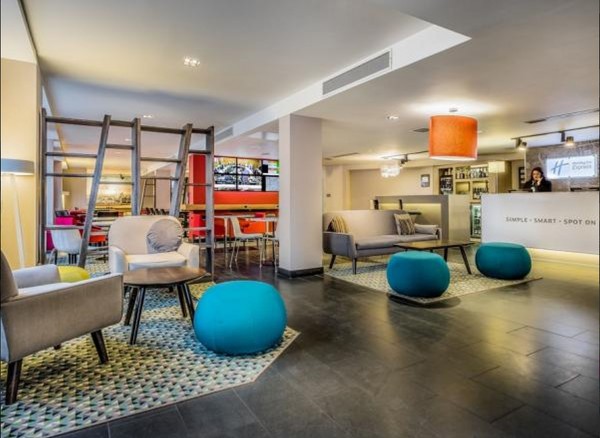 Modern hotel lobby with vibrant decor, perfect for networking events in Southwark.