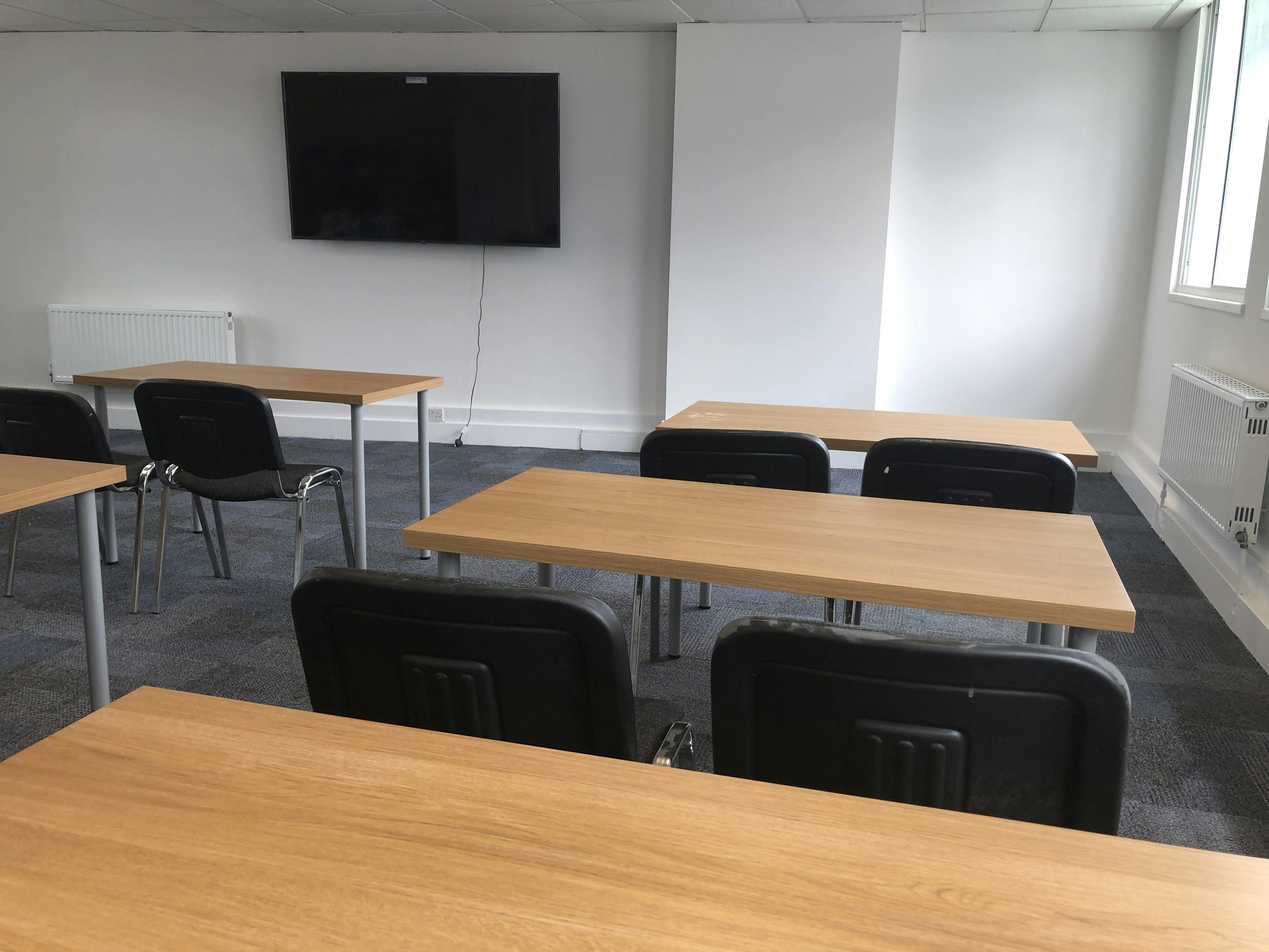 Minimalist meeting room in Tarling East Community Centre for workshops and training.