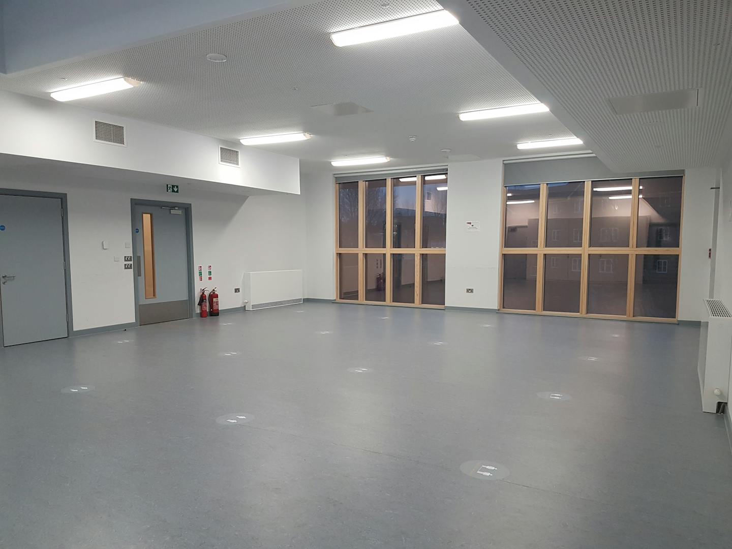 Versatile meeting space in Tarling East Community Centre, ideal for workshops and presentations.