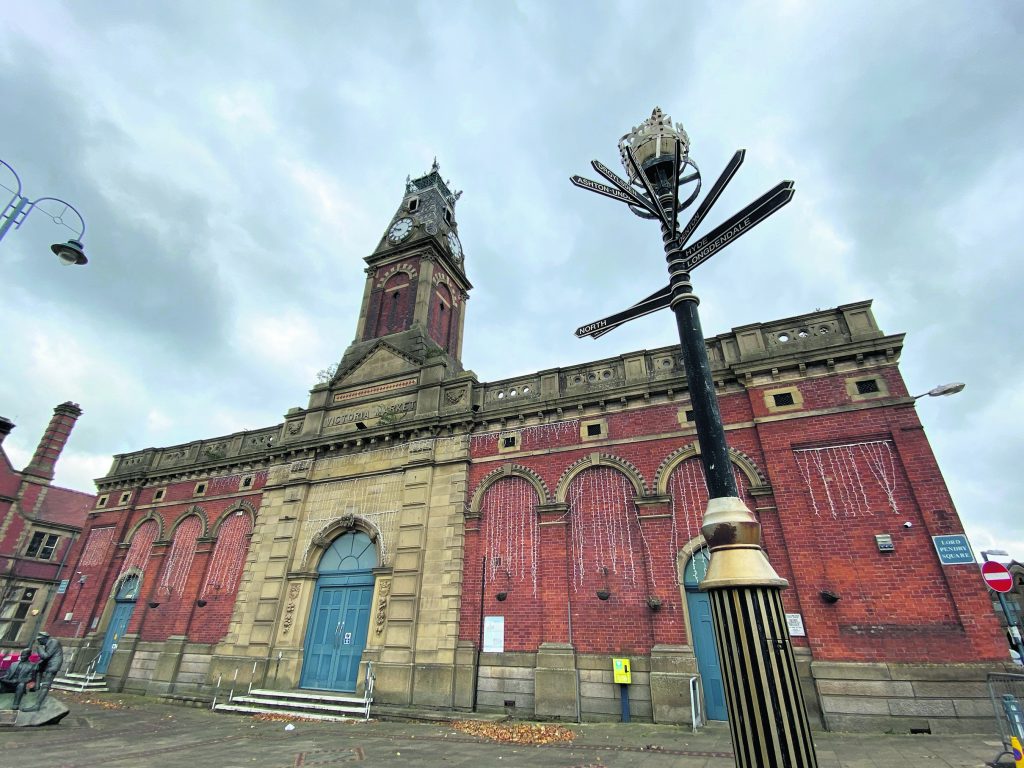 Historic Stalybridge Civic Hall with clock tower, perfect for events and gatherings.