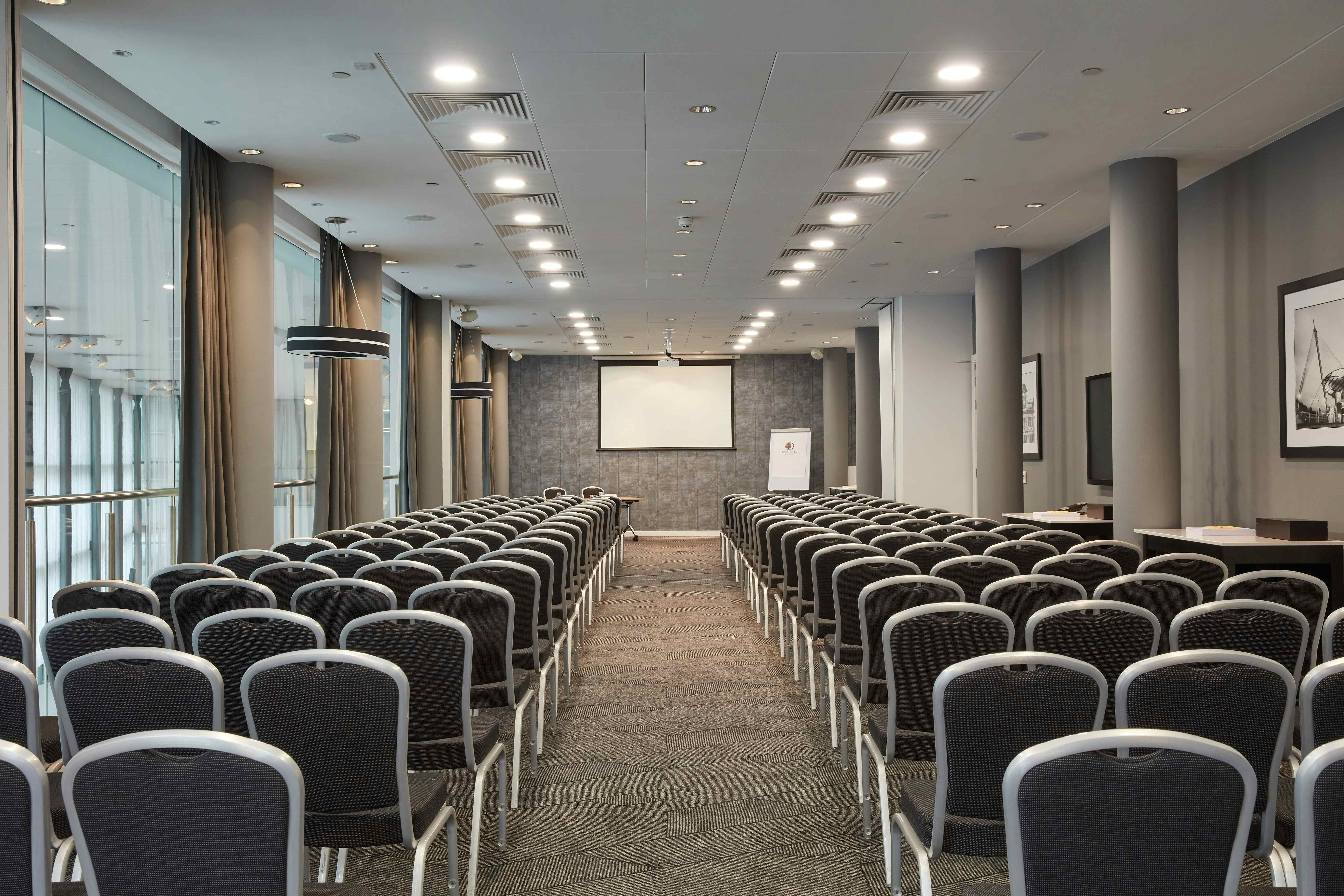 Bright conference room at DoubleTree Manchester, ideal for corporate workshops and events.