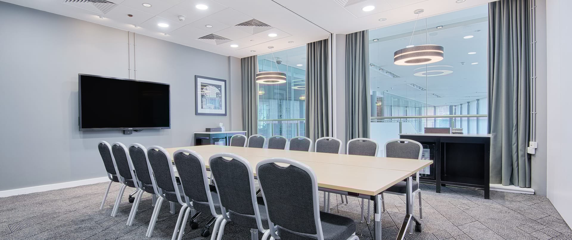 Modern meeting room at DoubleTree Manchester for professional events and collaborations.
