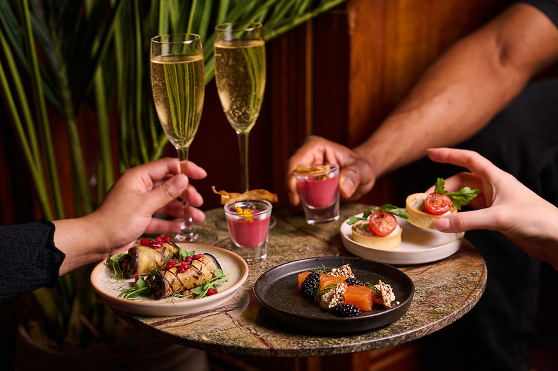 Elegant Sky Bar at London Coliseum with gourmet appetizers for upscale events.