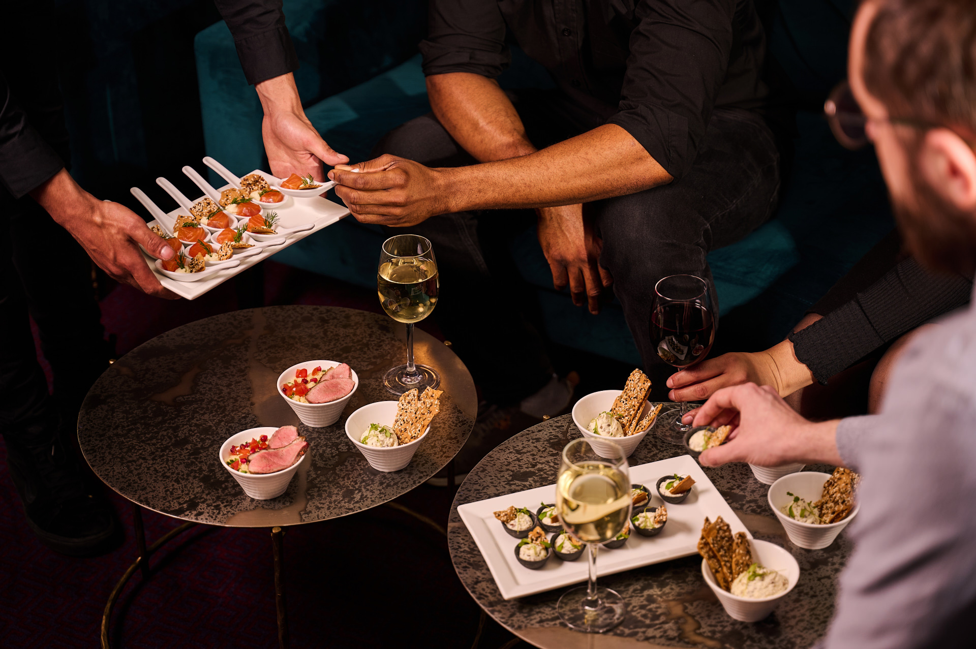 Elegant gathering in The Chairman’s Room, London Coliseum with gourmet appetizers and drinks.