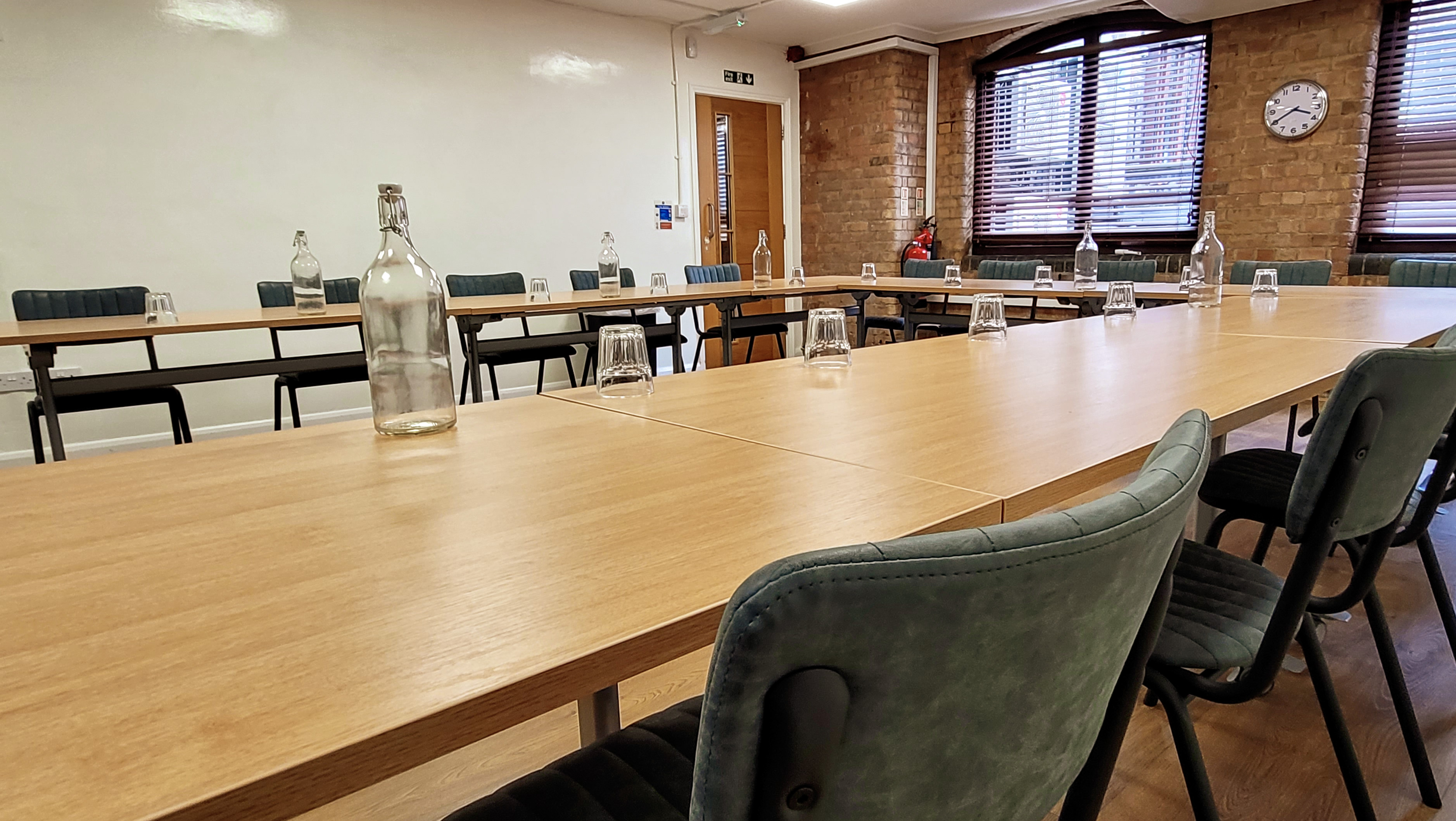 Blue Room at Remark! Events, featuring a long table for professional workshops.
