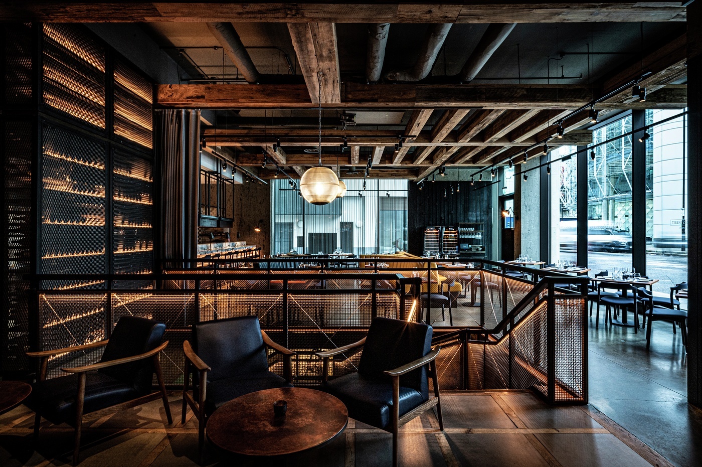 Stylish venue with wood accents for intimate meetings and events at Bread Street Kitchen.