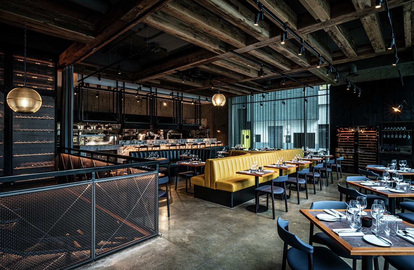 Exclusive Hire at Bread Street Kitchen with yellow banquette, perfect for upscale events.