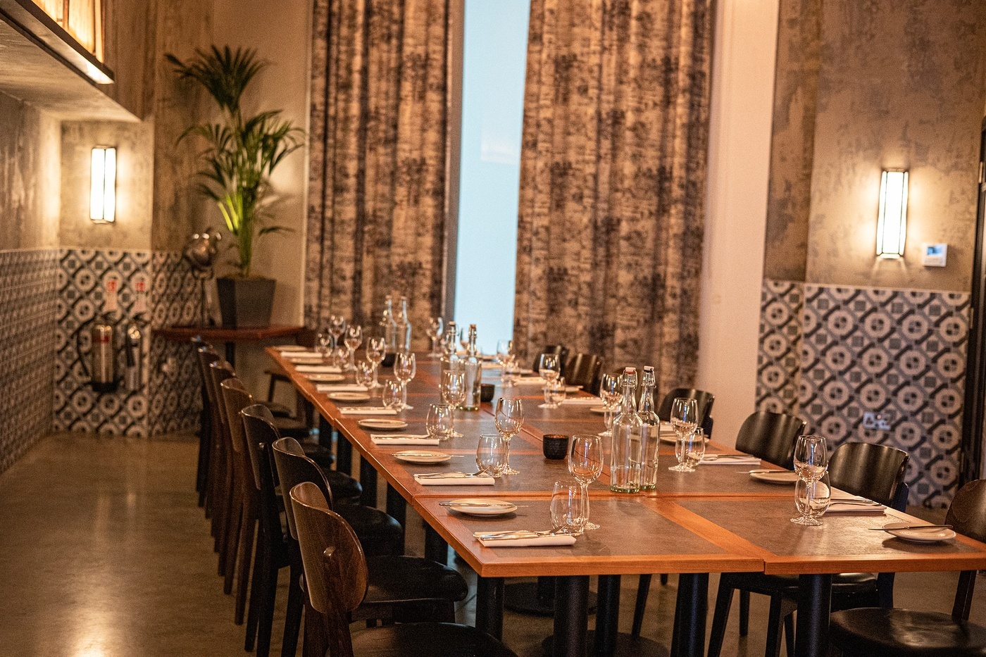 Private dining room at Bread Street Kitchen, elegant table setup for intimate events.