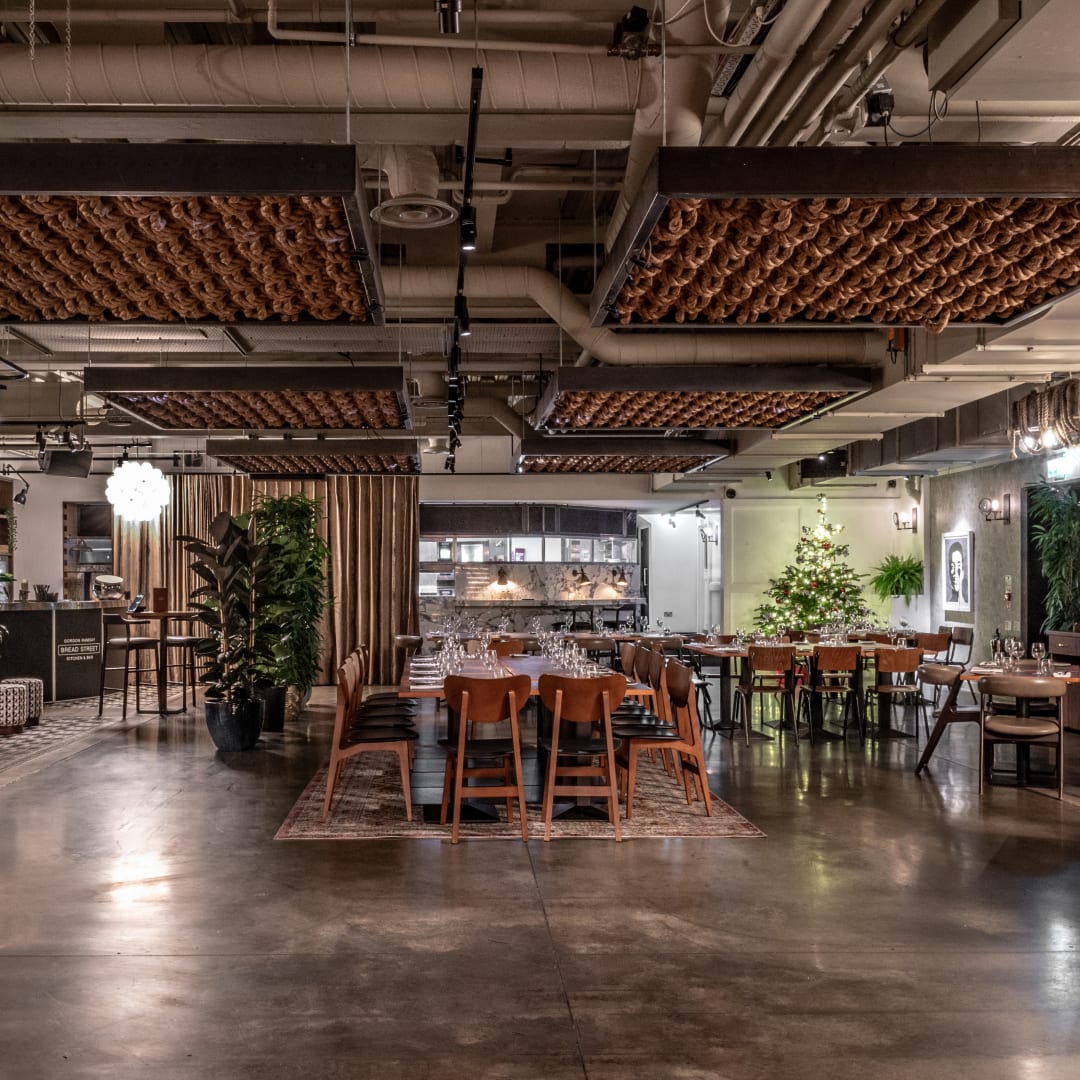 Modern event space with unique ceiling design for corporate meetings and social celebrations.