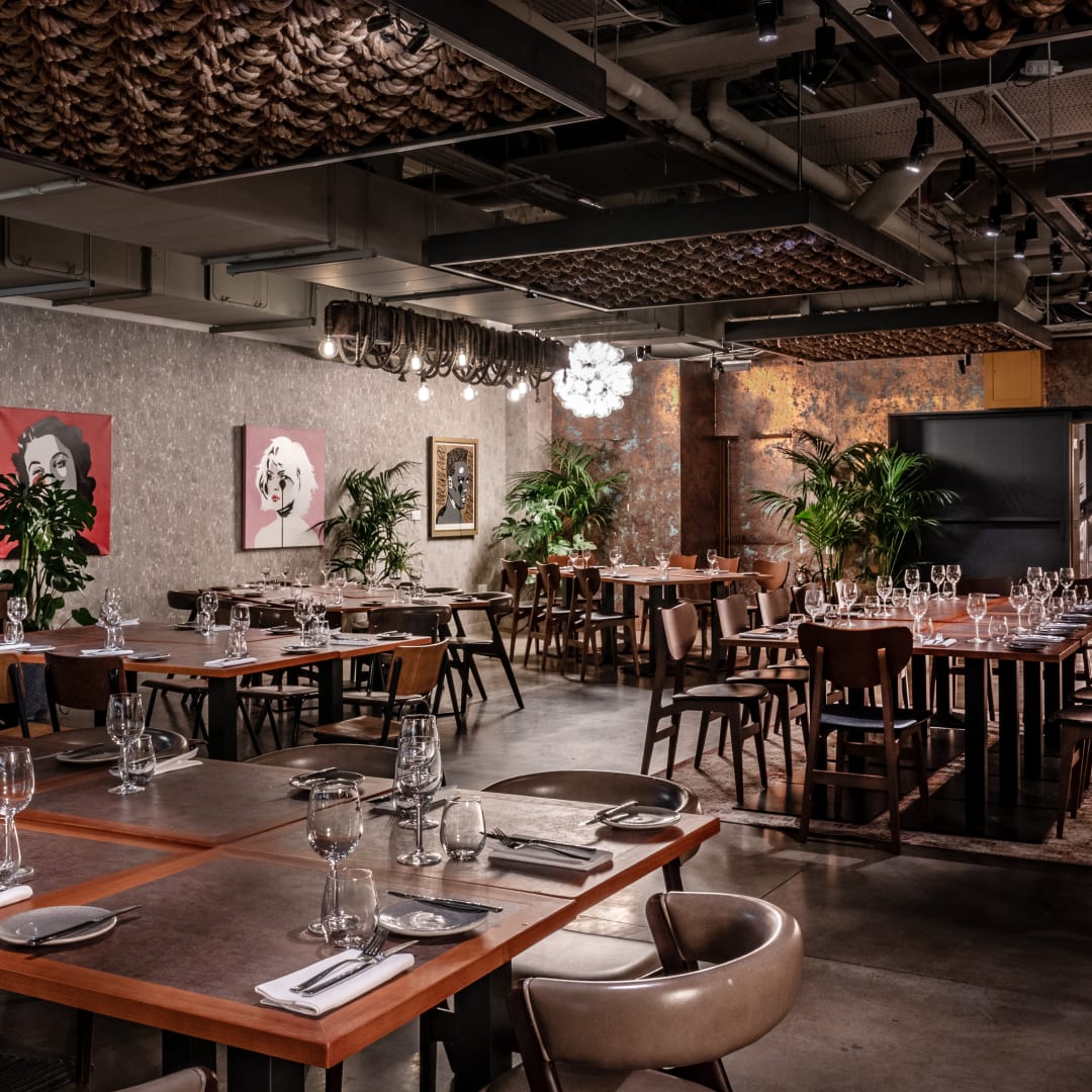 Stylish event space with warm lighting for corporate meetings and social celebrations.