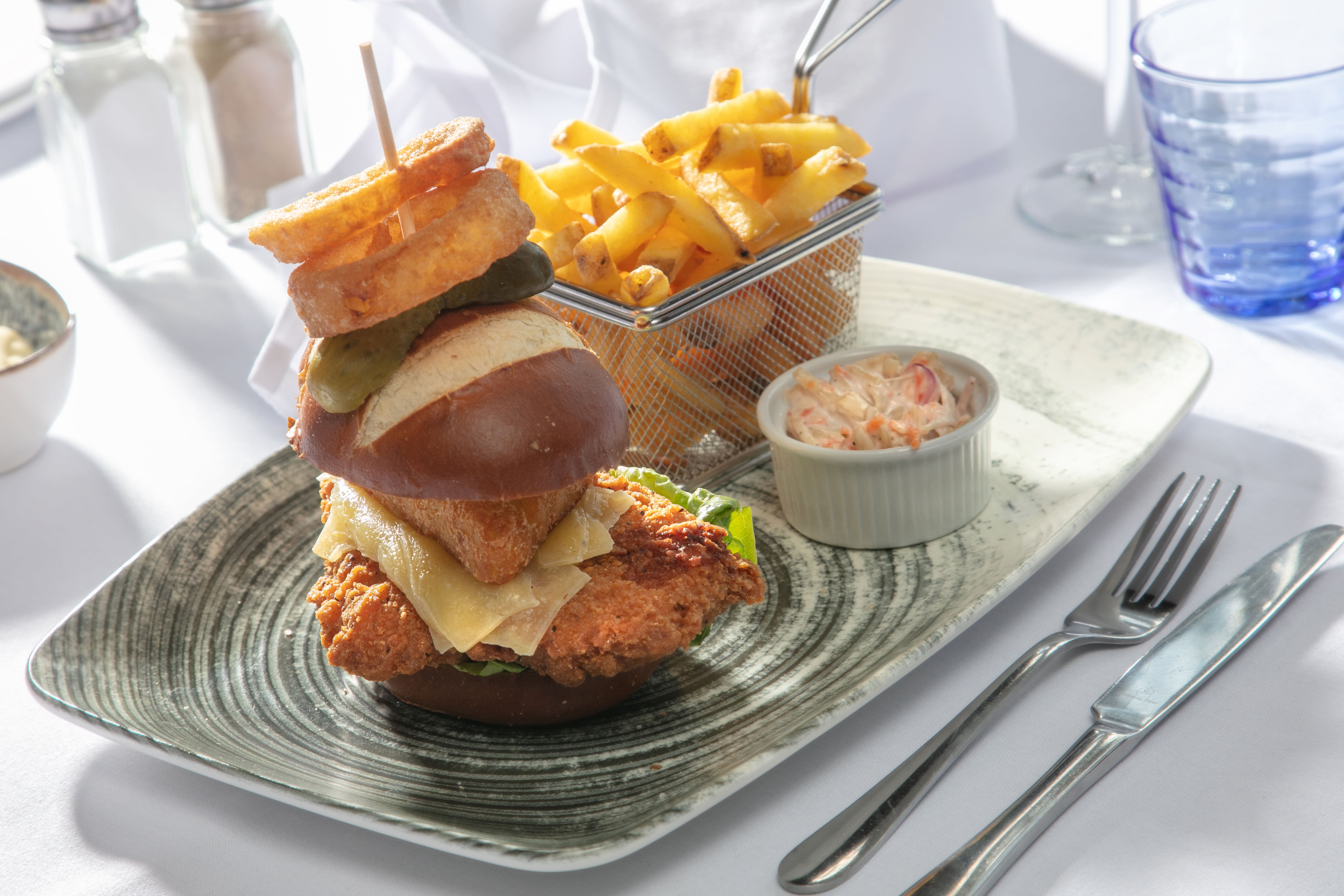 Gourmet burger presentation in The Stuart Hotel meeting room for networking events.