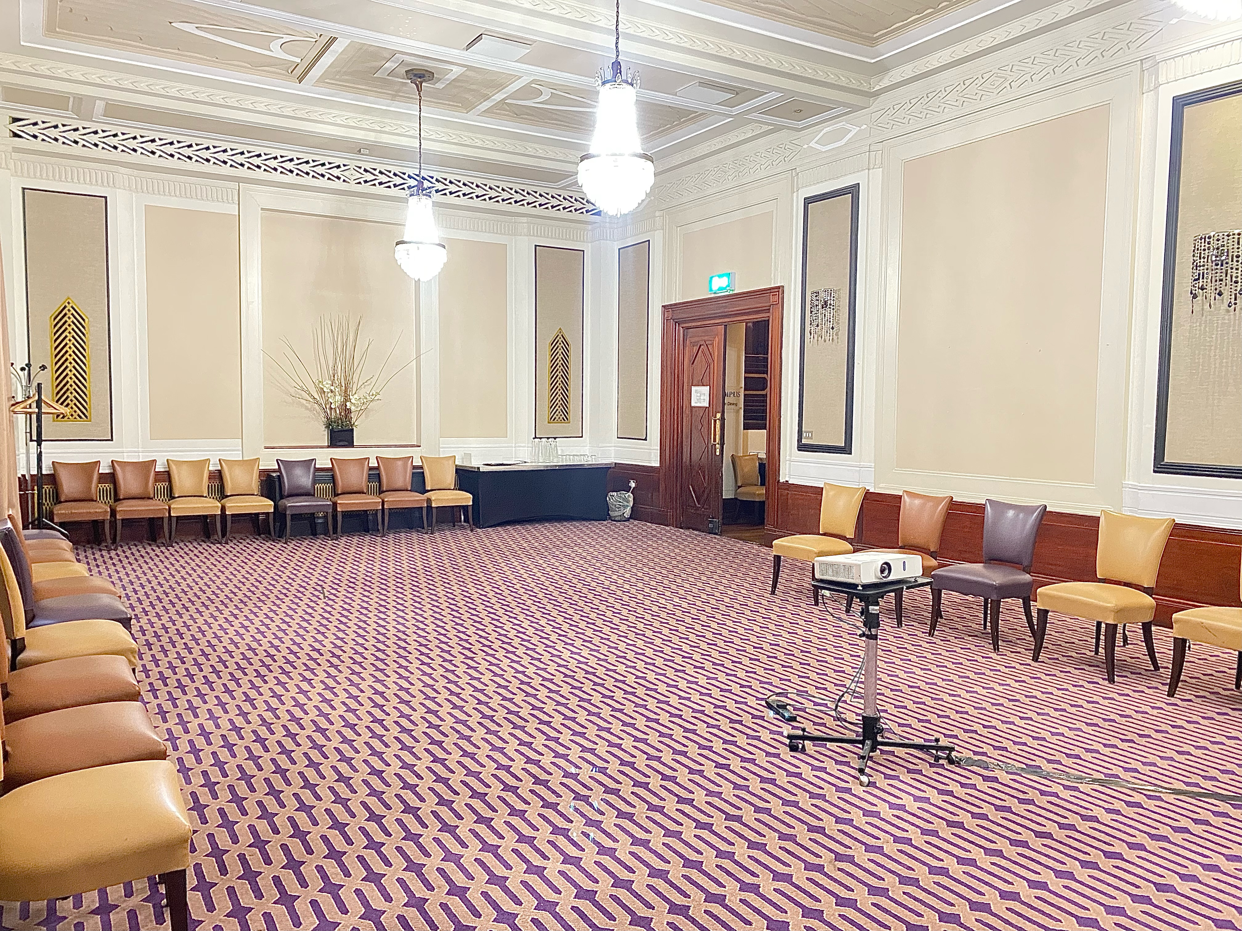 Private dining suite with elegant decor, ideal for meetings and workshops.