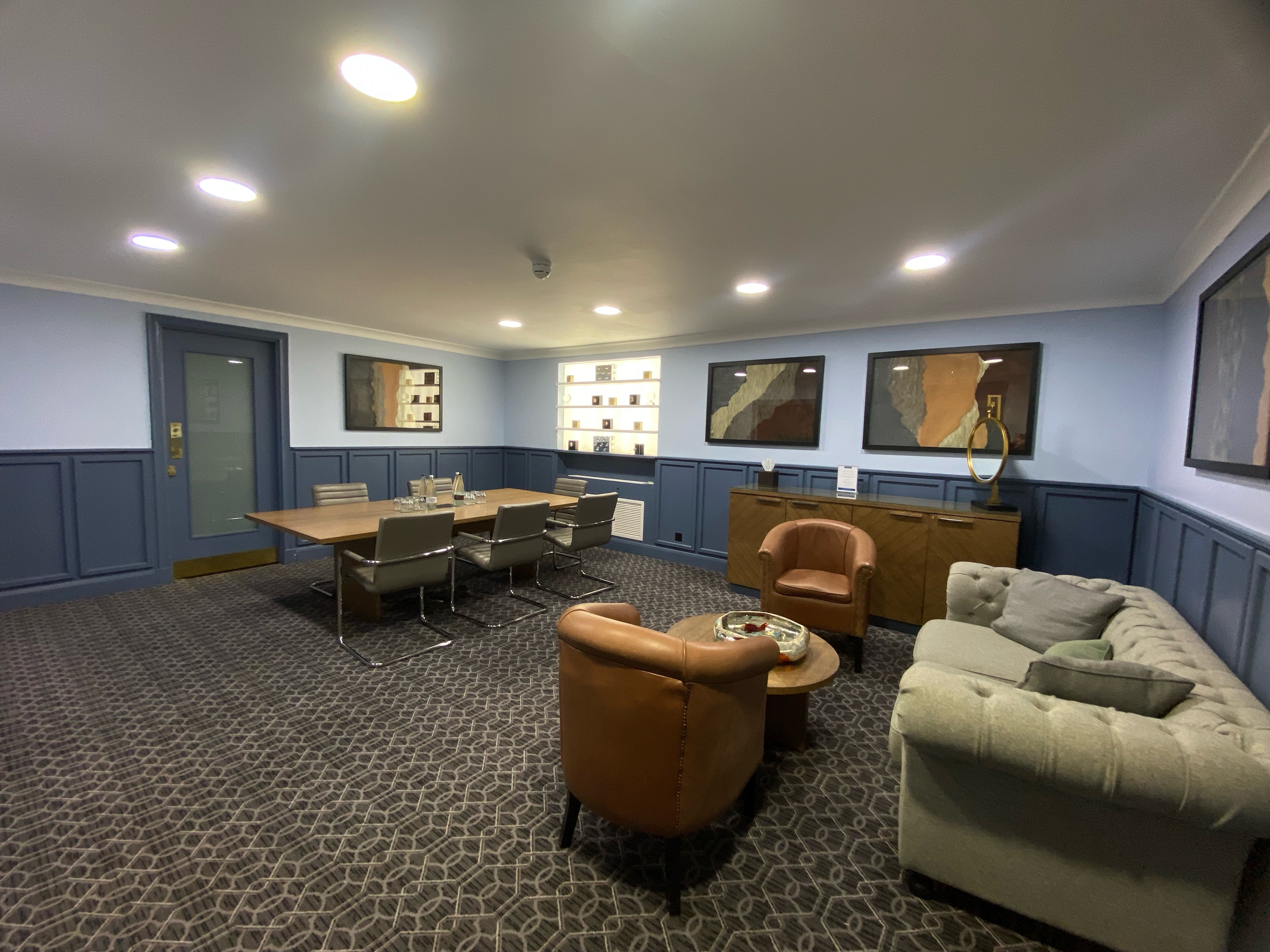 Hospitality Suite at De Vere Grand Connaught Rooms with modern conference table, ideal for meetings.