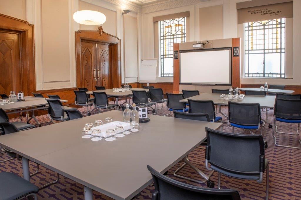 Denbigh Suite meeting room with natural light, ideal for conferences and events.