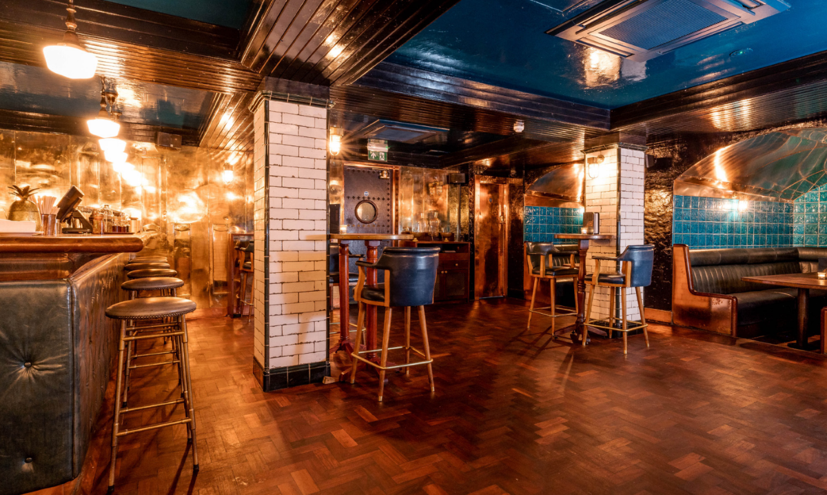 Intimate venue hire in Hawksmoor Spitalfields with warm lighting for private events.