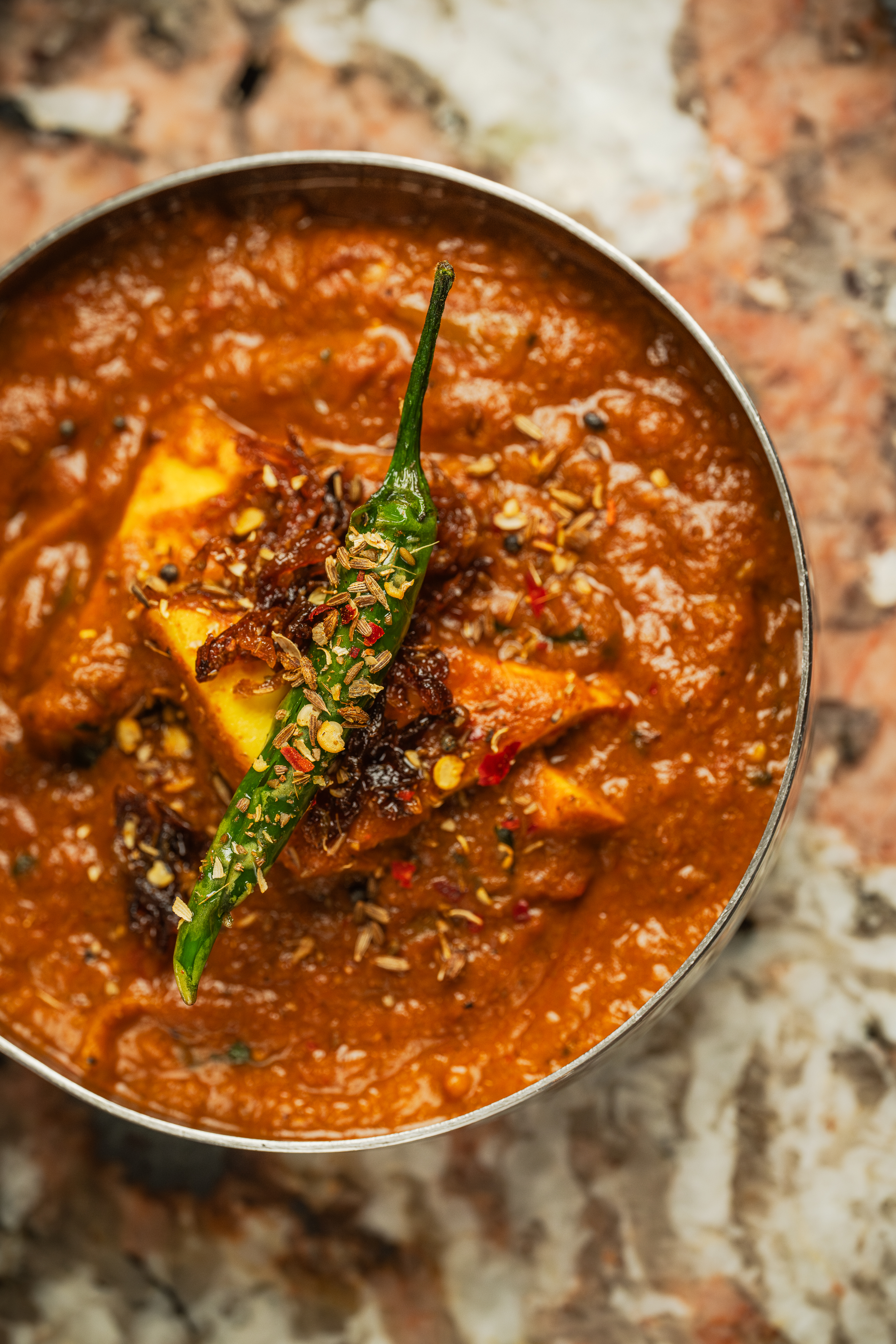 Vibrant paneer dish in spiced sauce at Bombay Delight for events and catering.