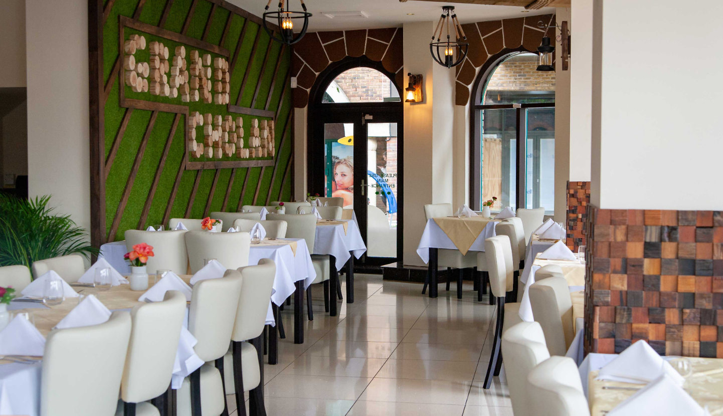 Private dining room at Grand Cholan with elegant decor for events and gatherings.