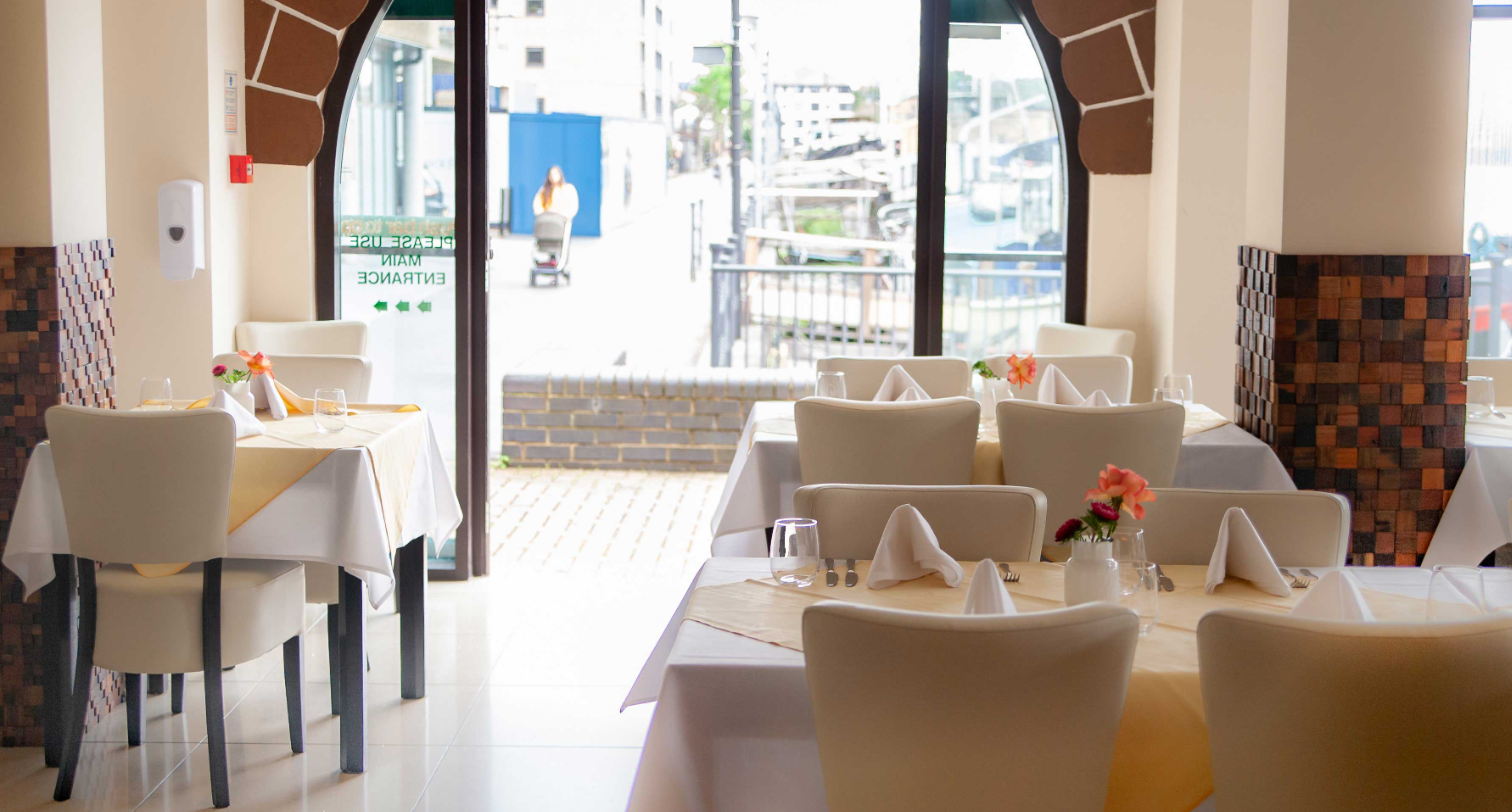 Private dining room at Grand Cholan, modern decor for intimate events and meetings.