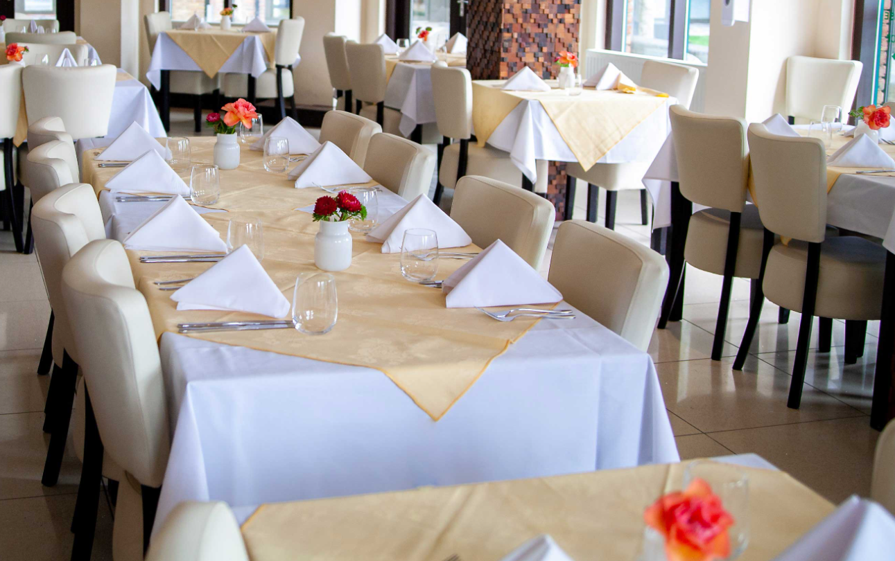 Private dining room at Grand Cholan, elegant setup for corporate events and gatherings.