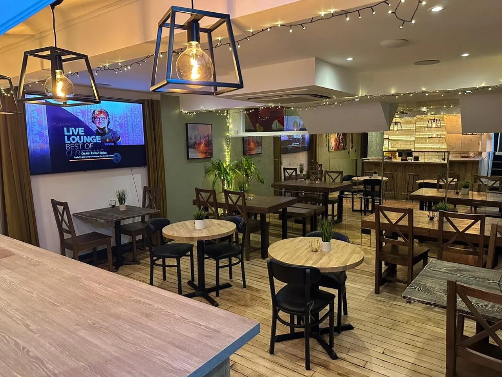 Bar area in Cafe M.A.D., ideal for networking events and meetings. Cozy atmosphere.