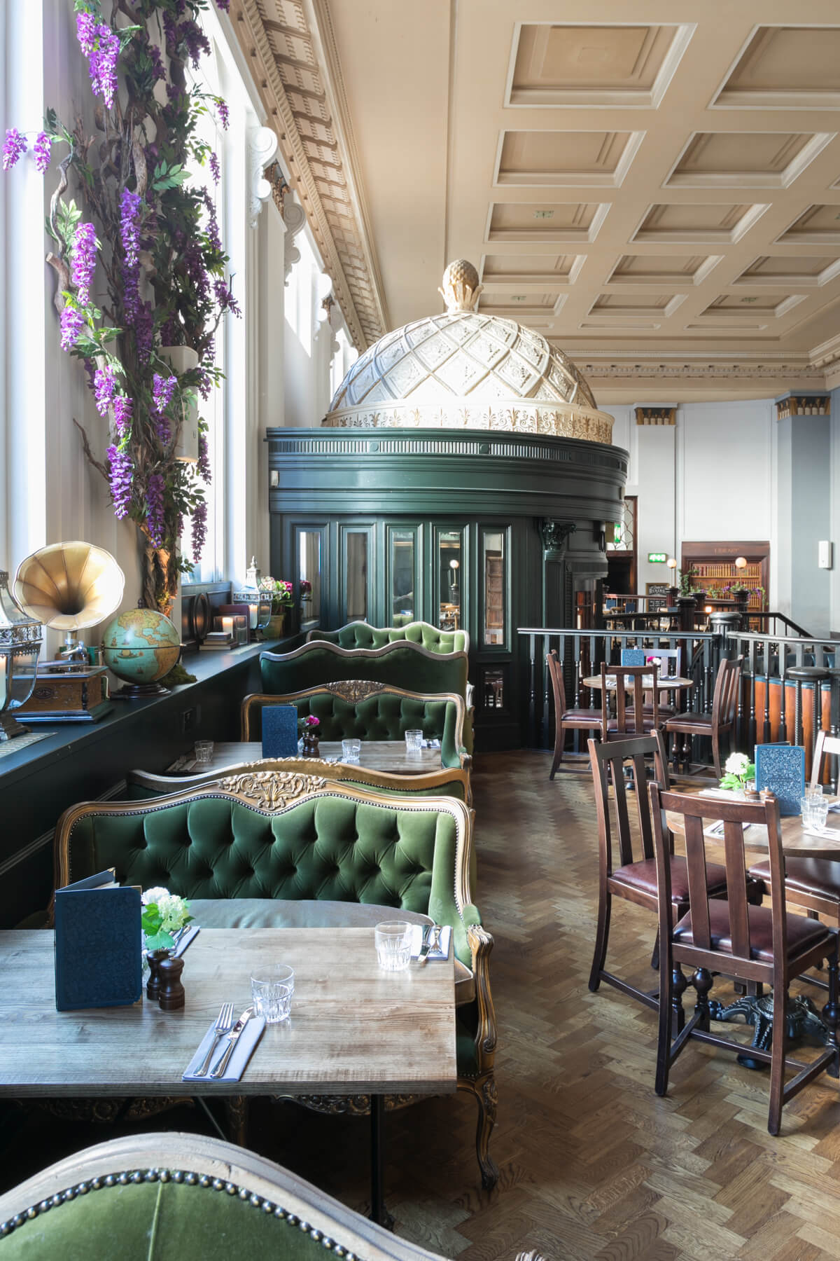 Stylish Birmingham restaurant with elegant green seating, perfect for networking events.