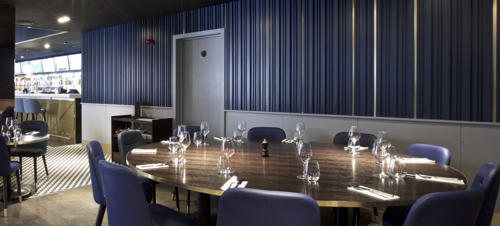 Private hire meeting space at Frankie's Sports Bar with elegant round table setup.