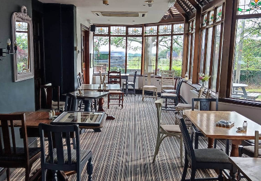 Charming venue at The Kilton Inn with natural light for intimate meetings and events.