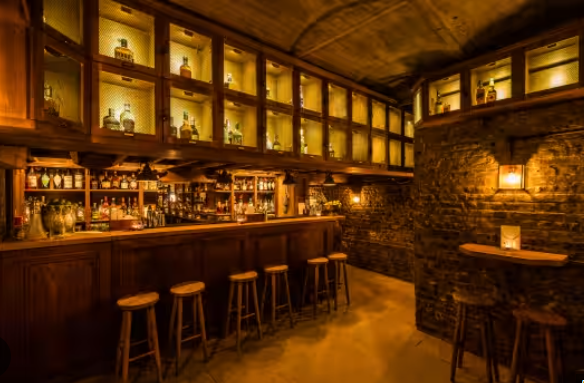 Chloë's Basement Bar with warm lighting, perfect for cocktail receptions and private parties.