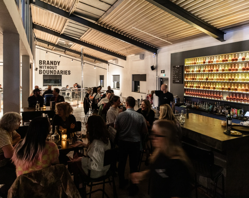 Vibrant bar at Burnt Faith Brandy House, perfect for networking and social events.