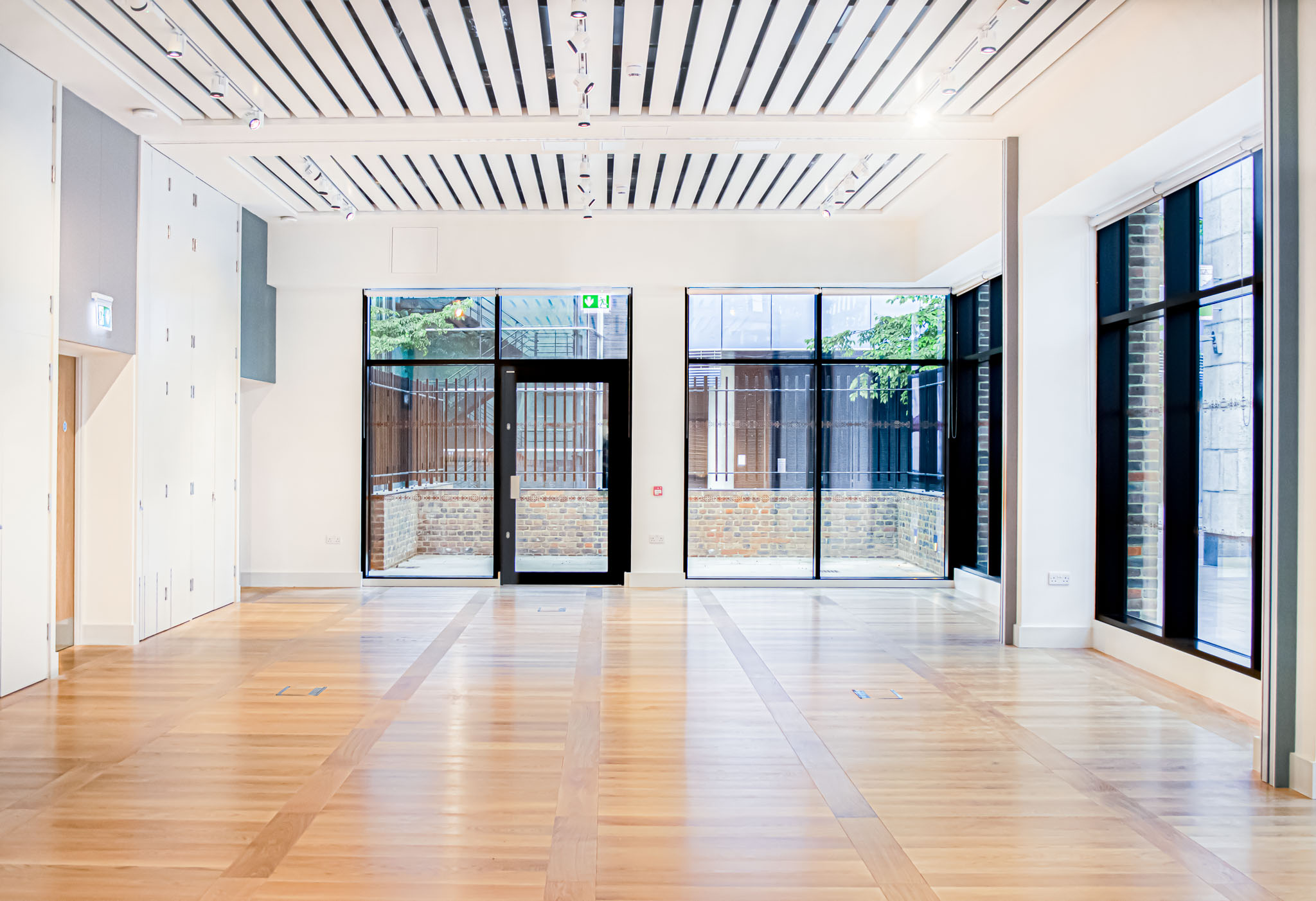 Versatile event space with large windows, ideal for meetings and workshops at Aldgate Centre.