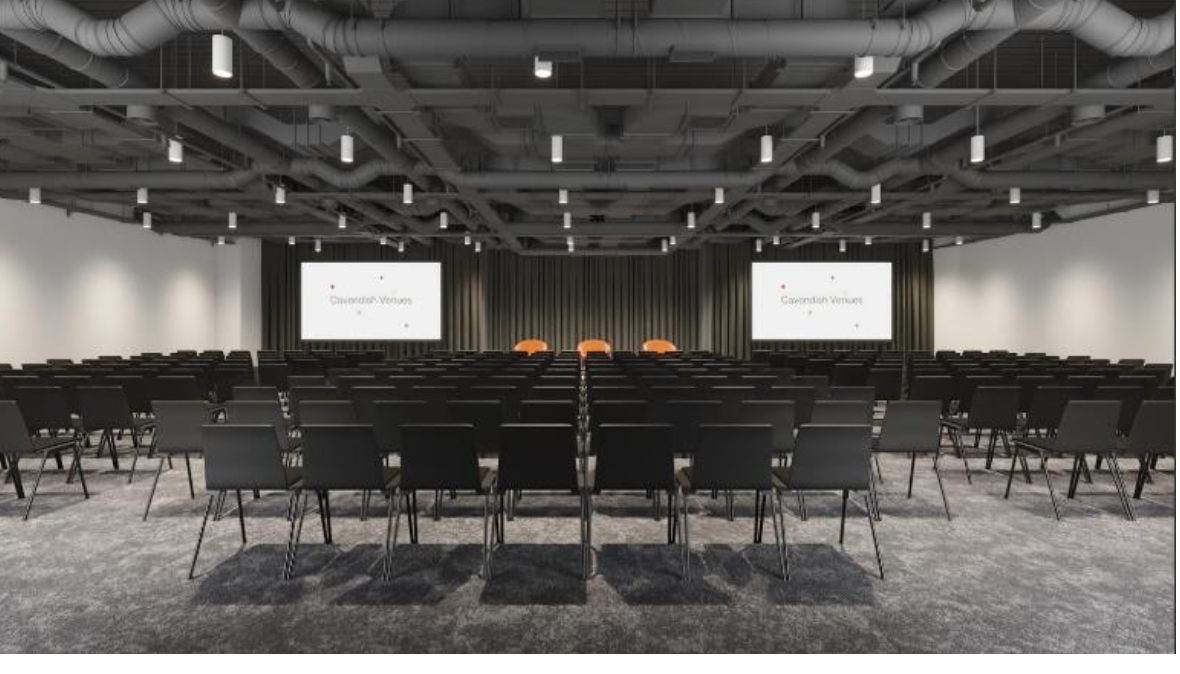 Minster Forum conference venue with black chairs and large screens for presentations.
